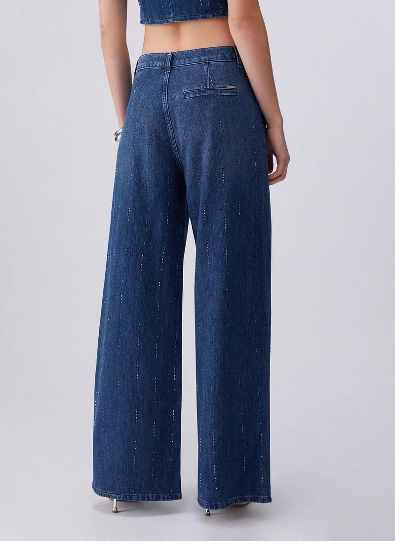 ليو جو Flared jeans with rhinestones